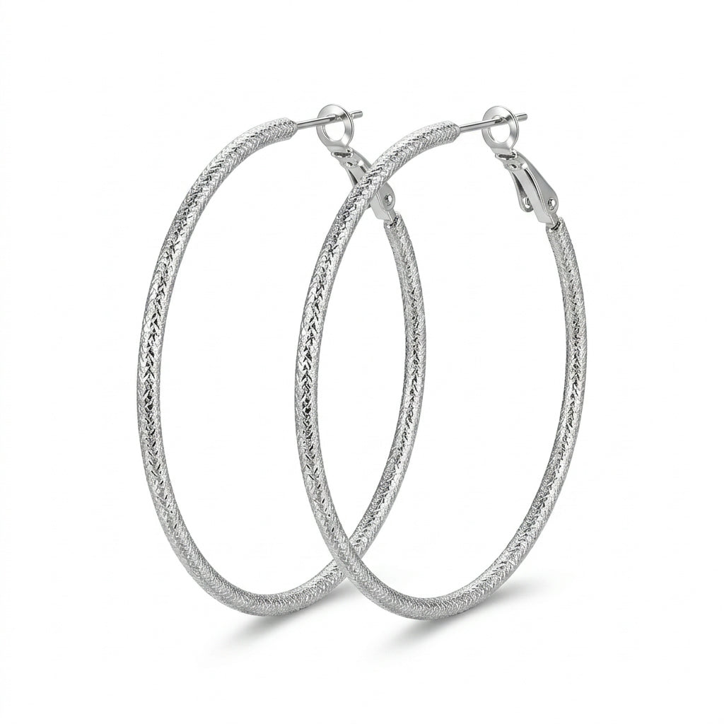 Silver Diamond-Cut Textured Hoop Earrings — Three-quarter angle view