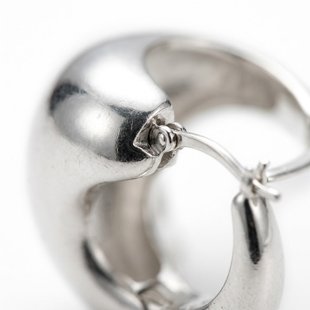 Silver Chunky Huggie Hoop Earrings — Close-up detail