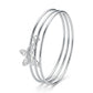 Silver Triple Bangle Set with Butterfly Charm — Three-quarter angle view