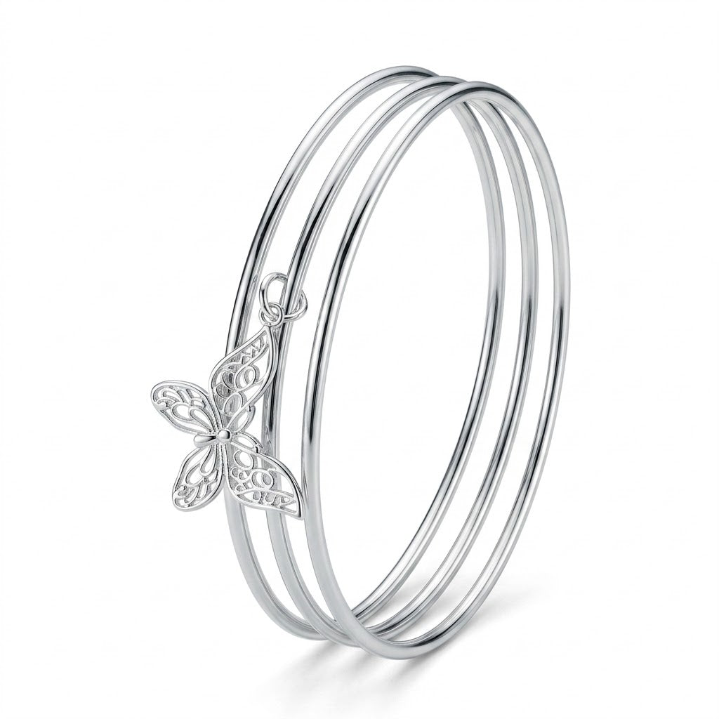 Silver Triple Bangle Set with Butterfly Charm — Three-quarter angle view