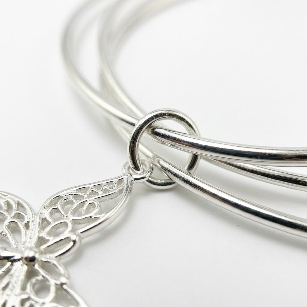 Silver Triple Bangle Set with Butterfly Charm — Close-up detail