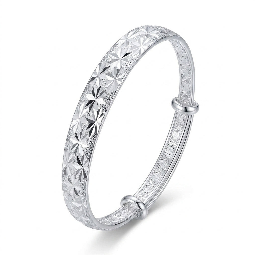 Silver Diamond-Cut Star Burst Adjustable Bangle — Three-quarter angle view