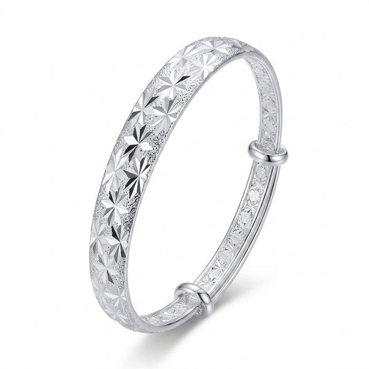 Silver Diamond-Cut Star Burst Adjustable Bangle — Three-quarter angle view