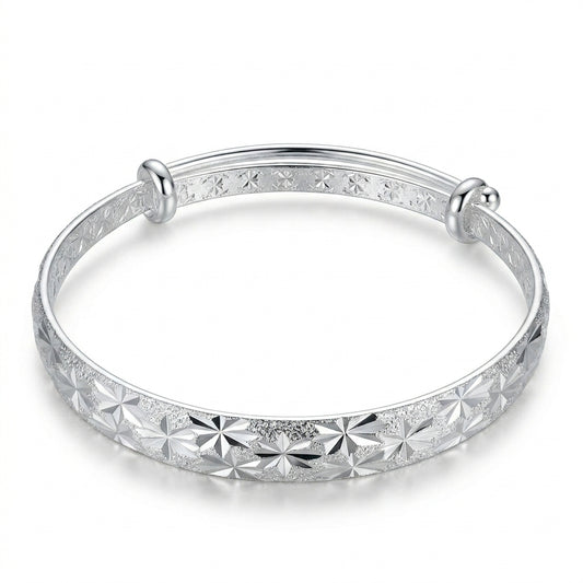 Silver Diamond-Cut Star Burst Adjustable Bangle — Front view